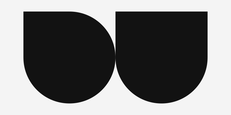 Minimalist black geometric shapes resembling stylized letters 'D' and 'U' on a light gray background.